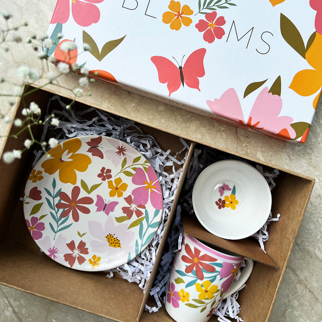 A gift box of spring floral snack set with a plate, mug and small bowl